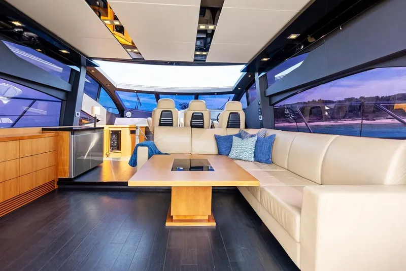 Slide: The Image of Luxurious interior of 2011 Sunseeker 64 Predator yacht with modern seating and panoramic windows. - 9