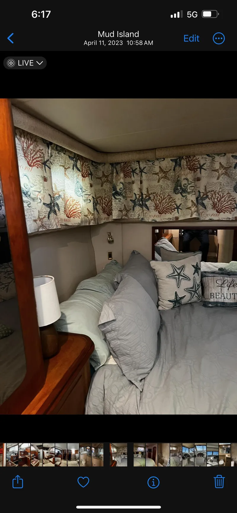 Slide: The Image of 1999 Cruisers aft cabin with cozy bedding and nautical-themed decor. - 24
