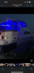 Slide: The Image of 1999 Cruisers aft cabin yacht with blue LED lights at night. - 19