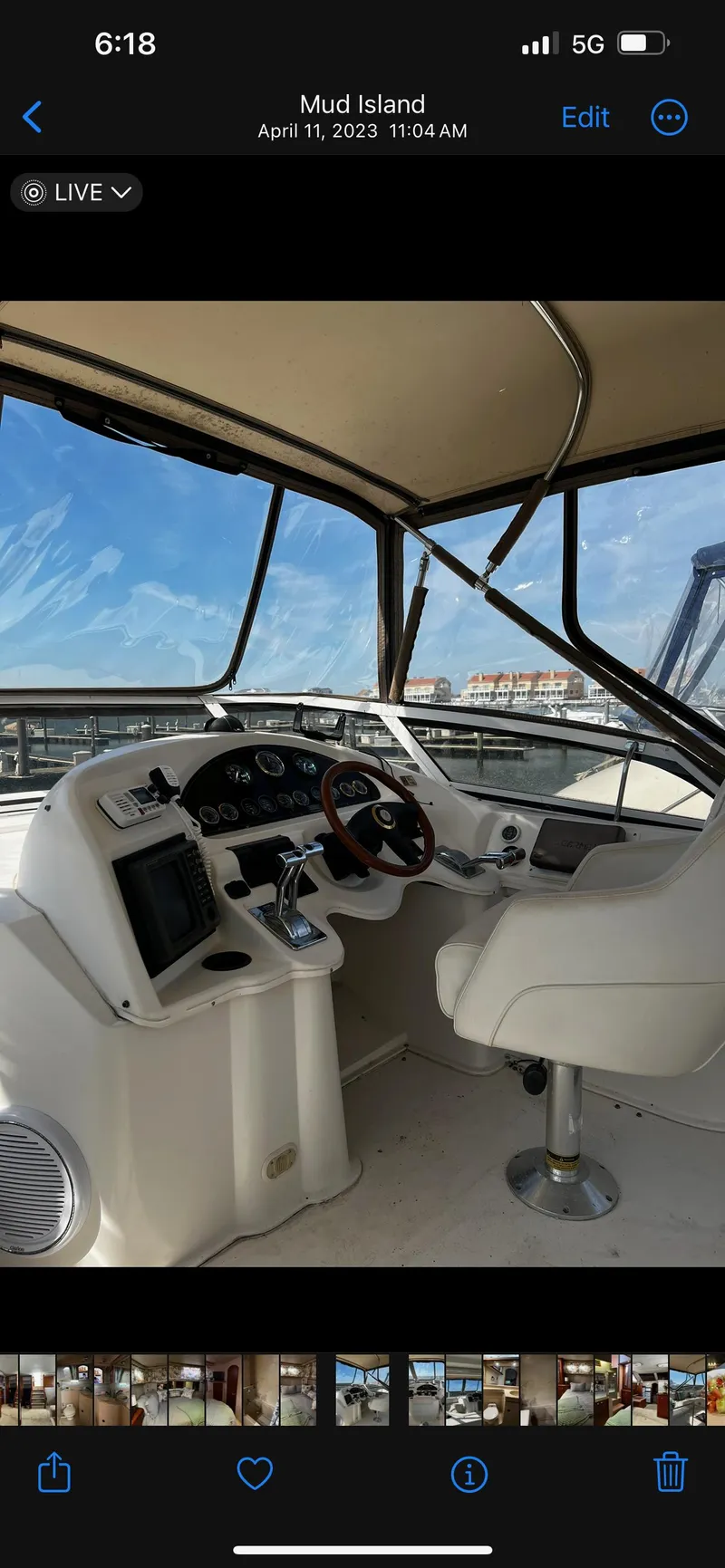 Slide: The Image of 1999 Cruisers aft cabin boat helm with steering wheel and navigation controls. - 25