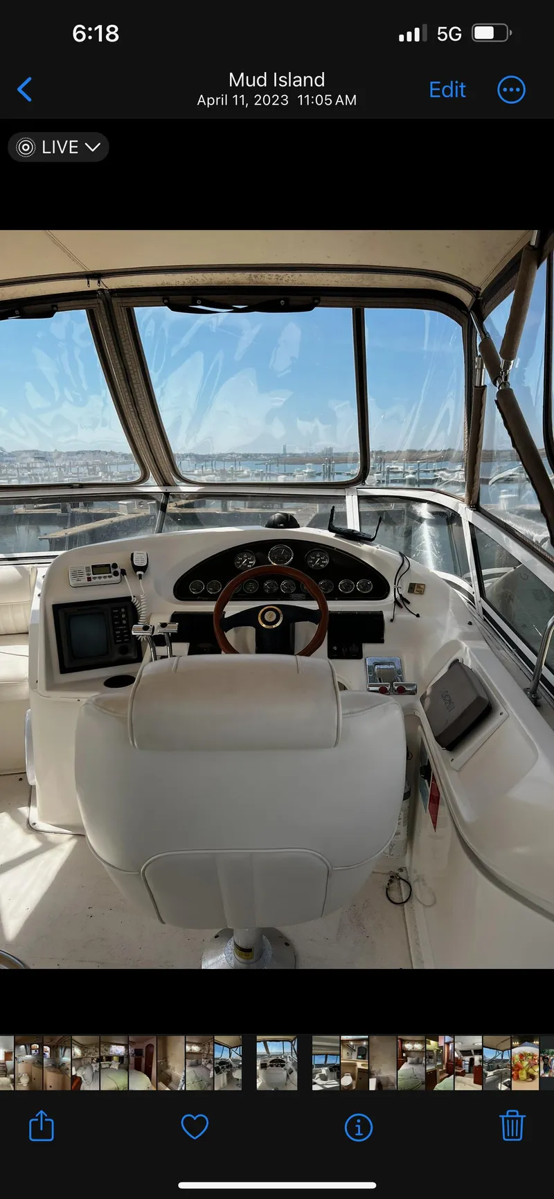 Slide: The Image of 1999 Cruisers aft cabin boat helm with navigation instruments and panoramic water view. - 26