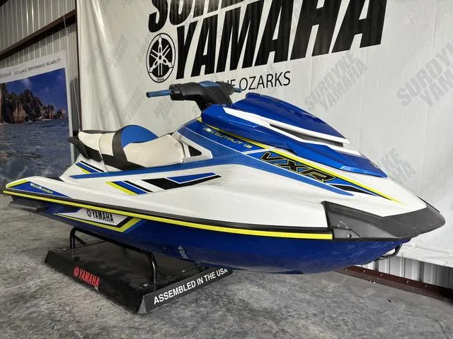 Slide: The Image of 2019 Yamaha WaveRunner VXR in blue and white on display indoors. - 2