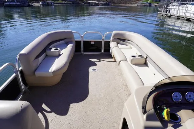 Slide: The Image of 2014 Sun Tracker Party Barge 24 XP3 pontoon boat with spacious seating on a calm lake. - 4