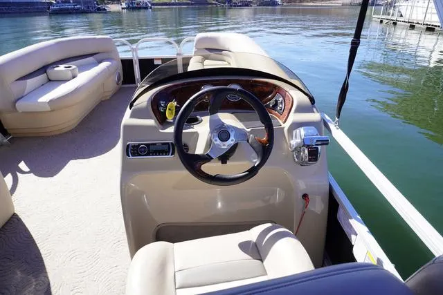 Slide: The Image of 2014 Sun Tracker Party Barge 24 XP3 interior with steering wheel and seating. - 5