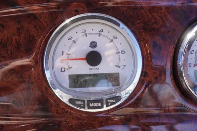 Slide: The Image of Close-up of 2014 Sun Tracker Party Barge 24 XP3 RPM gauge on wood-grain dashboard. - 7