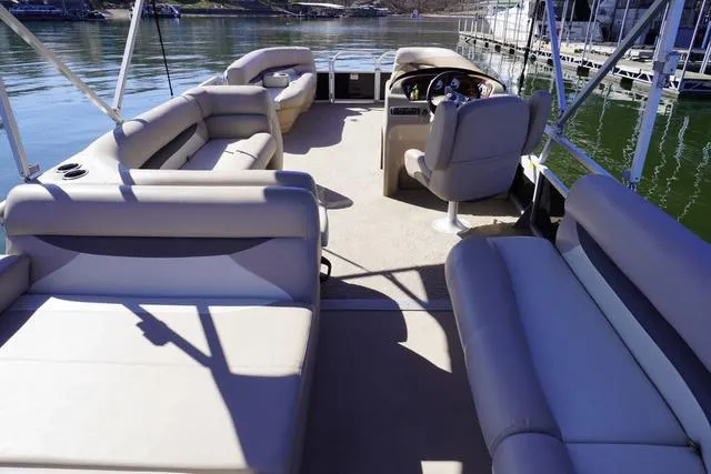 Slide: The Image of 2014 Sun Tracker Party Barge 24 XP3 with spacious seating on a calm lake. - 9