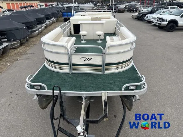 Slide: The Image of 2000 Weeres Sundeck 280 pontoon boat with 2021 Honda 100HP engine, parked at dealership. - 11