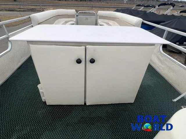 Slide: The Image of 2000 Weeres Sundeck 280 TT pontoon boat with seating and storage, featuring 2021 Honda 100HP engine. - 18