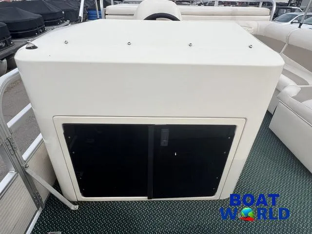 Slide: The Image of Weeres Sundeck 280 pontoon boat interior with seating and table, 2000 model. - 22