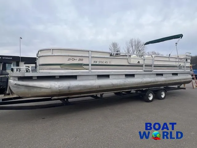 Slide: The Image of 2000 Weeres Sundeck 280 pontoon boat with 2021 Honda 100HP engine on trailer. - 4