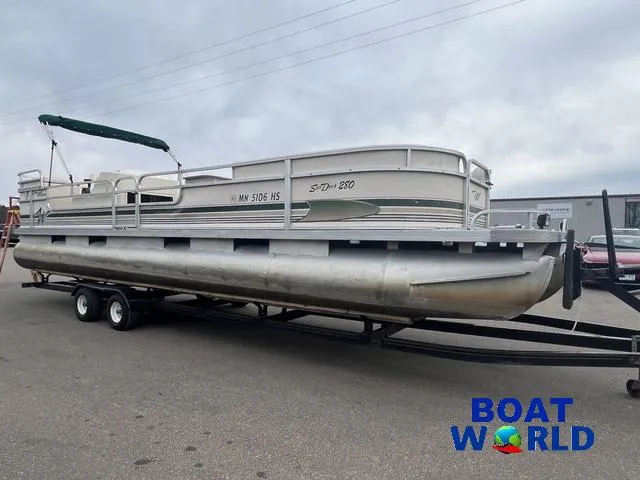 Slide: The Image of 2000 Weeres Sundeck 280 pontoon boat with 2021 Honda 100HP engine on trailer. - 7