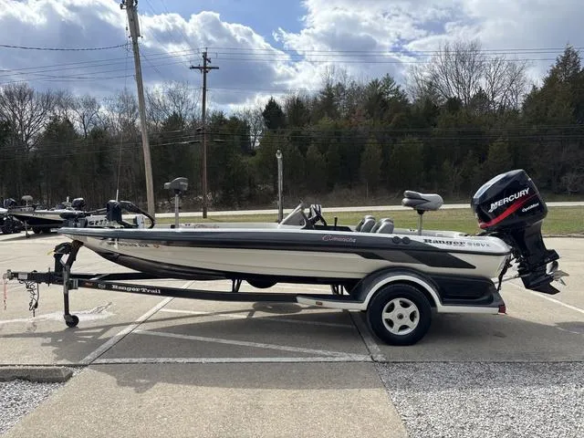 Slide: The Image of 2001 Ranger 518VX boat with Mercury engine on trailer, parked outdoors. - 12