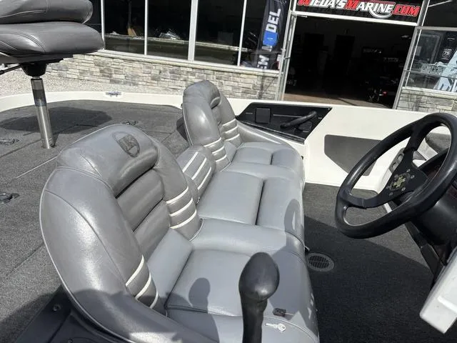 Slide: The Image of 2001 Ranger 518VX boat interior with gray leather seats and steering wheel. - 4
