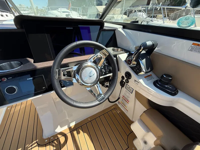 Slide: The Image of 2022 Sea Ray 290 SDX OB helm with modern controls and sleek design. - 18