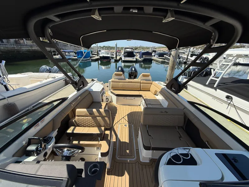 Slide: The Image of 2022 Sea Ray 290 SDX OB boat interior with luxurious seating and modern design. - 20