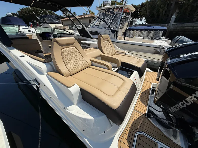 Slide: The Image of 2022 Sea Ray 290 SDX OB boat with luxurious seating and Mercury outboard engine. - 6