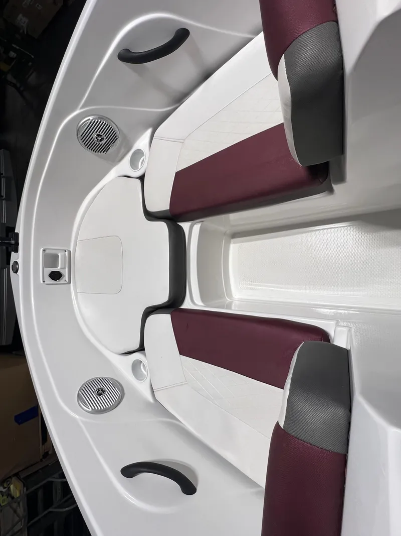 Slide: The Image of 2022 Tahoe 185 S boat interior with maroon and white seating. - 20