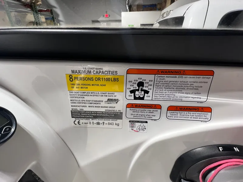 Slide: The Image of 2022 Tahoe 185 S boat capacity label, maximum 8 persons or 1100 lbs, safety warnings visible. - 22