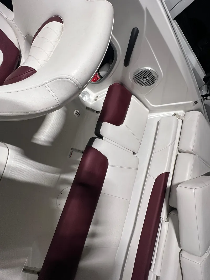 Slide: The Image of 2022 Tahoe 185 S boat interior with white and maroon seating. - 24