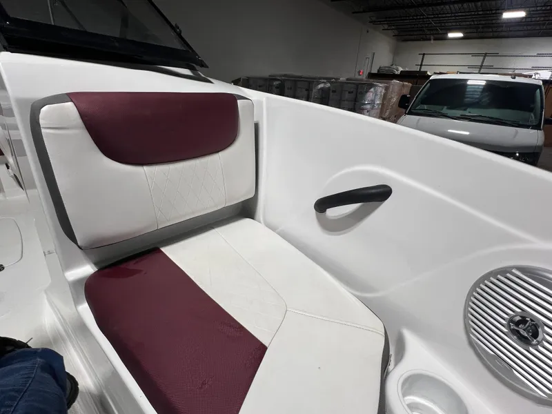 Slide: The Image of Interior of 2022 Tahoe 185 S boat with maroon and white seating. - 29