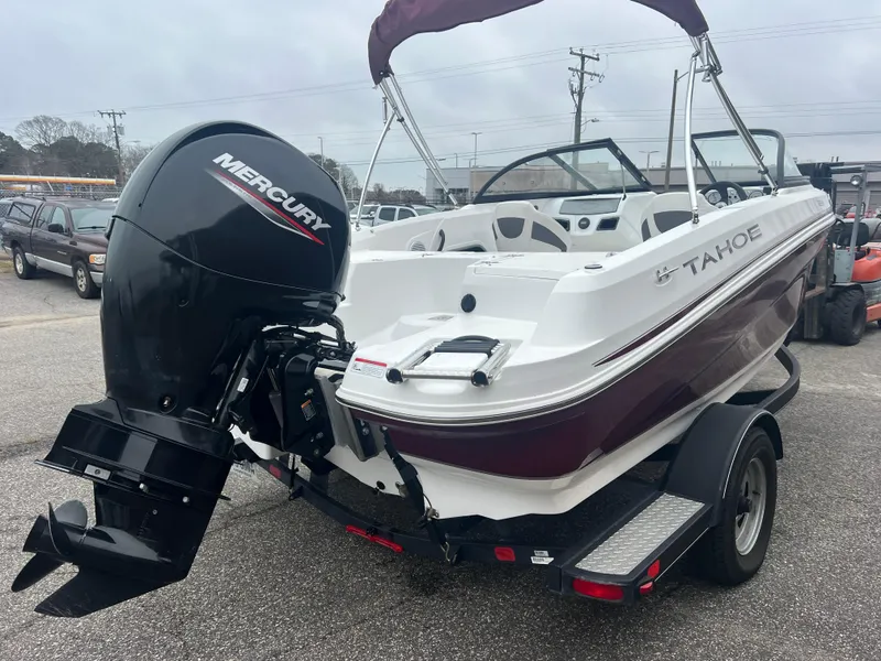 Slide: The Image of 2022 Tahoe 185 S boat with Mercury outboard motor on a trailer. - 6