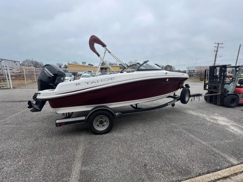 Slide: The Image of 2022 Tahoe 185 S boat with Mercury outboard motor on a trailer. - 7
