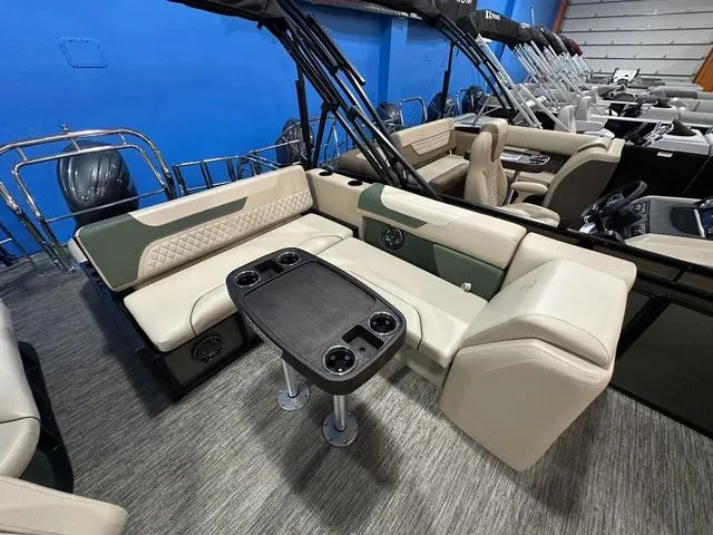 Slide: The Image of 2025 Godfrey Pontoons Sweetwater 2286 SFL interior with seating and table, showcasing luxury design. - 14
