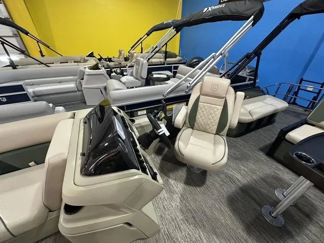 Slide: The Image of 2025 Godfrey Sweetwater 2286 SFL Sport Tube pontoon boat interior with seating and helm. - 18