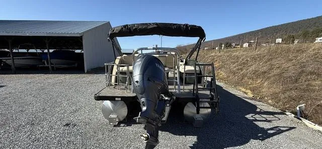 Slide: The Image of 2025 Godfrey Pontoons Sweetwater 2286 SFL Sport Tube, parked outdoors, rear view. - 24