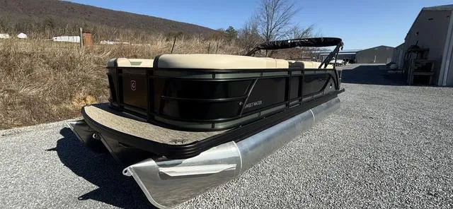 Slide: The Image of 2025 Godfrey Pontoons Sweetwater 2286 SFL Sport Tube on gravel, side view. - 25