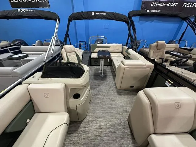 Slide: The Image of 2025 Godfrey Sweetwater 2286 SFL Sport Tube pontoon interior with luxurious seating and modern design. - 4