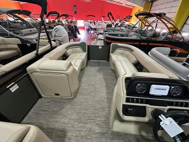 Slide: The Image of Interior of 2025 Godfrey Sweetwater 2286 SFL pontoon boat with beige seating and modern dashboard. - 5