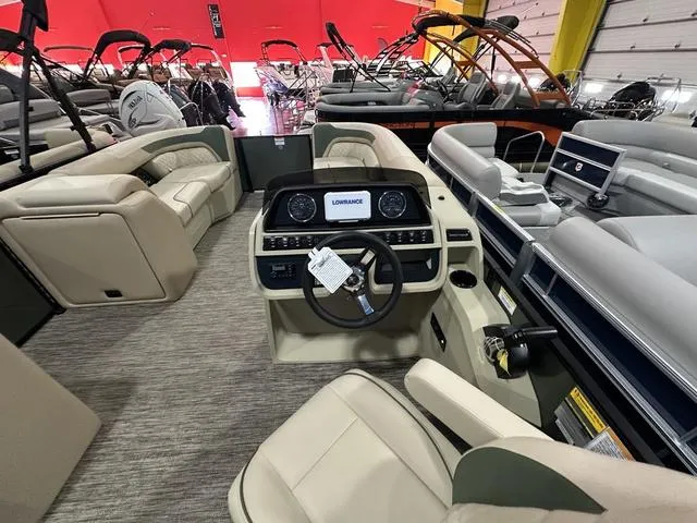 Slide: The Image of 2025 Godfrey Pontoons Sweetwater 2286 SFL Sport Tube interior with modern dashboard and seating. - 6