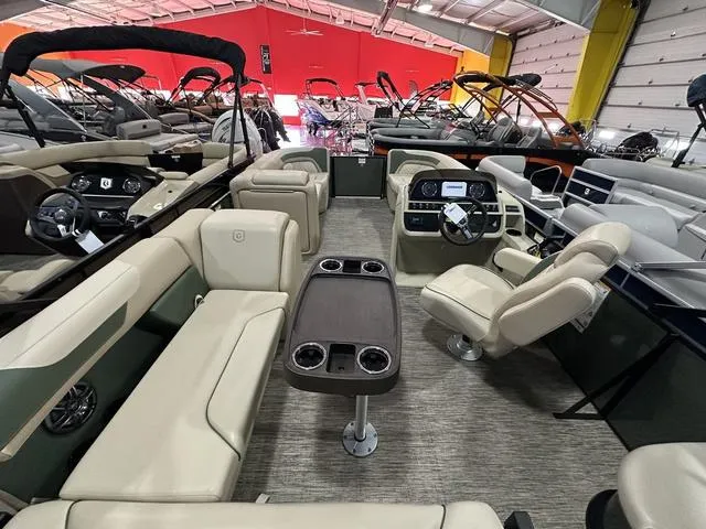 Slide: The Image of 2025 Godfrey Sweetwater 2286 SFL pontoon interior with plush seating and modern dashboard. - 8