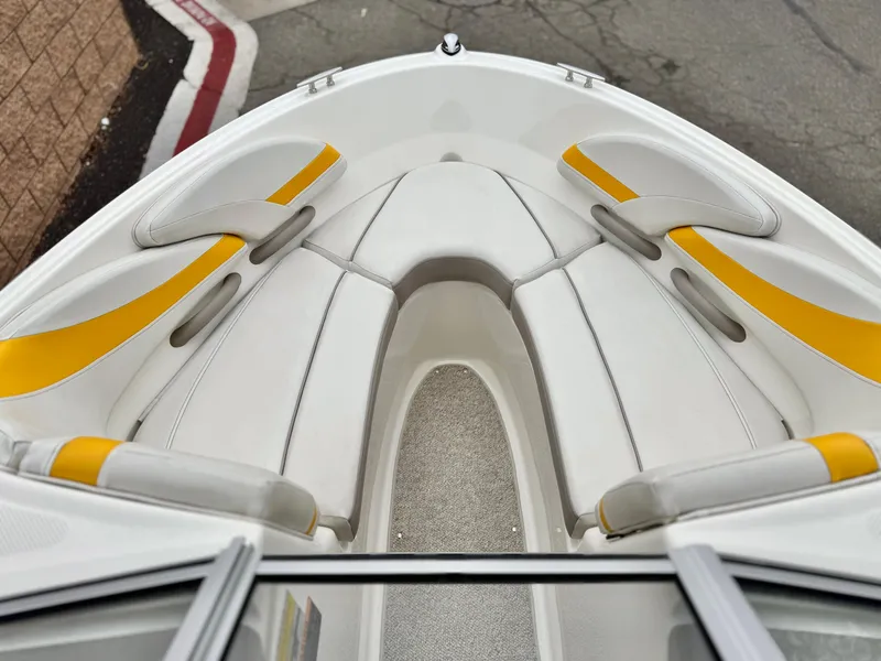 Slide: The Image of 2005 Maxum 1800 SR3 boat interior with white and yellow seating. - 10