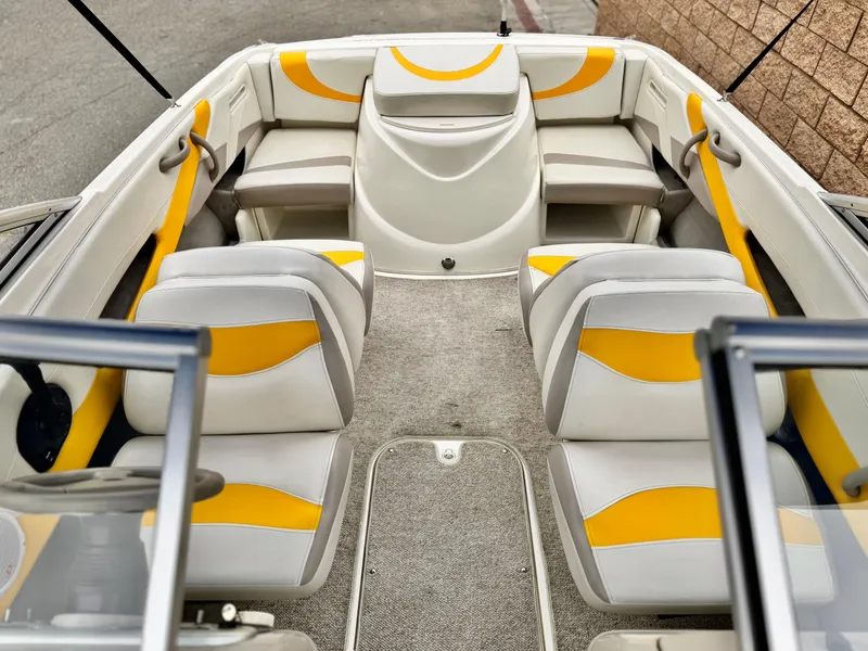Slide: The Image of 2005 Maxum 1800 SR3 boat interior with yellow and white seating. - 11