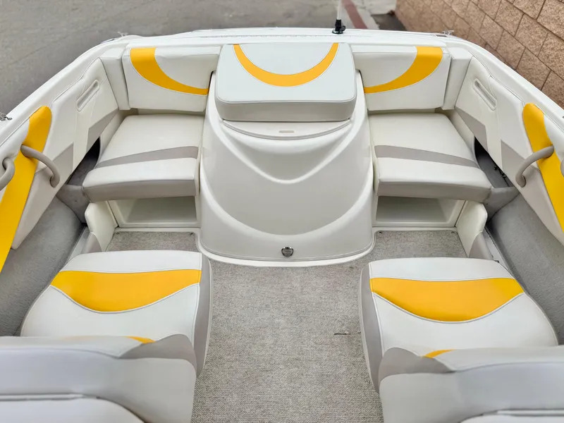 Slide: The Image of 2005 Maxum 1800 SR3 boat interior with yellow and white seating. - 12