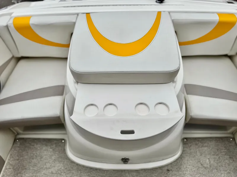 Slide: The Image of 2005 Maxum 1800 SR3 boat interior with white and yellow seating design. - 13