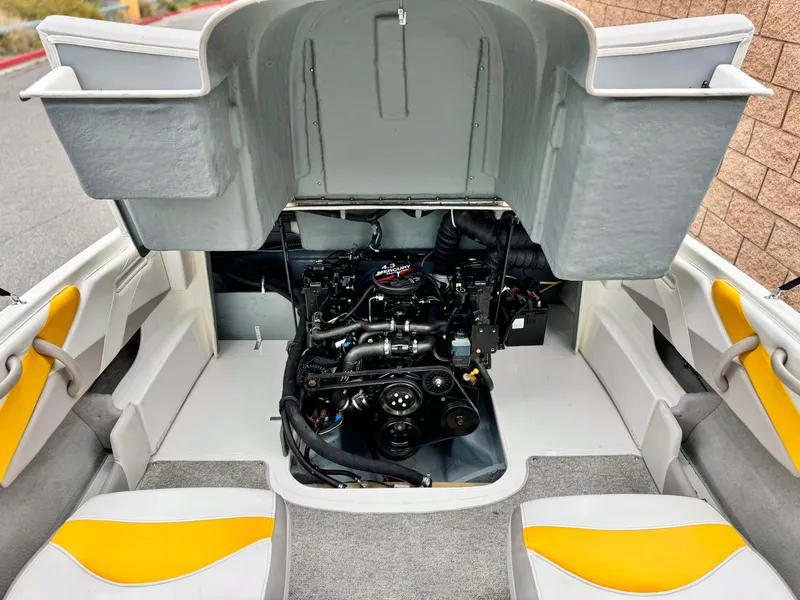 Slide: The Image of 2005 Maxum 1800 SR3 boat engine compartment with open hatch, showcasing interior details. - 14