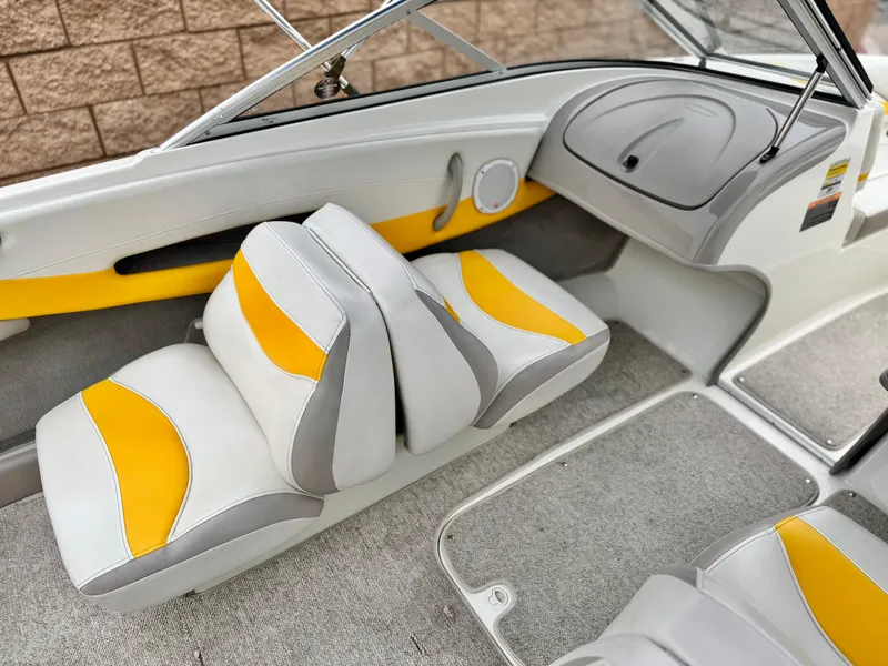 Slide: The Image of 2005 Maxum 1800 SR3 boat interior with yellow and gray seating. - 18