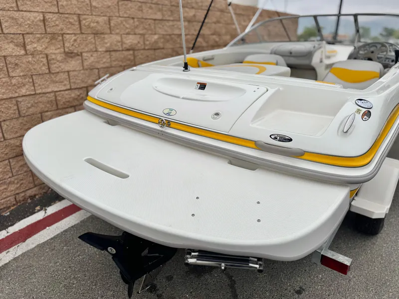 Slide: The Image of 2005 Maxum 1800 SR3 boat with yellow accents, rear view showing swim platform. - 6