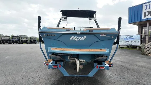 Slide: The Image of 2021 Tigé RZX Class 22 RZX boat, rear view, parked outdoors. - 24