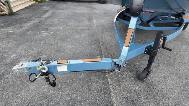 Slide: The Image of 2021 Tigé RZX Class 22 RZX boat trailer hitch on asphalt driveway. - 6