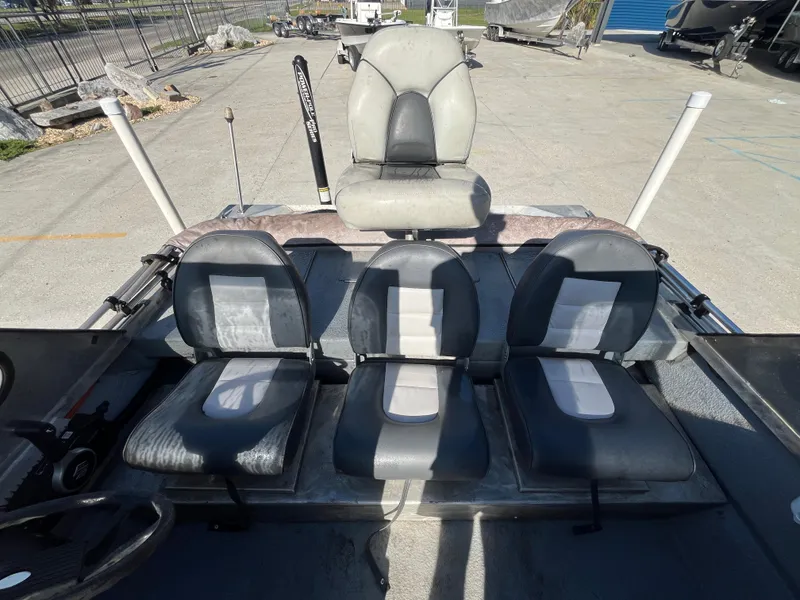 Slide: The Image of 1991 Scully's 18ft Aluminum Walk Thru boat interior with four seats. - 12