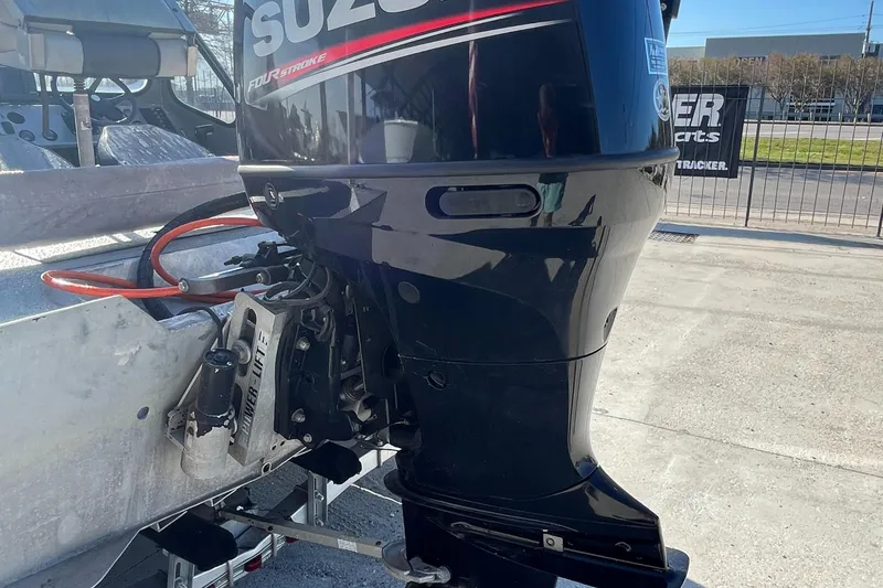 Slide: The Image of 1991 Scully's 18ft Aluminum Walk Thru boat with Suzuki outboard motor. - 15