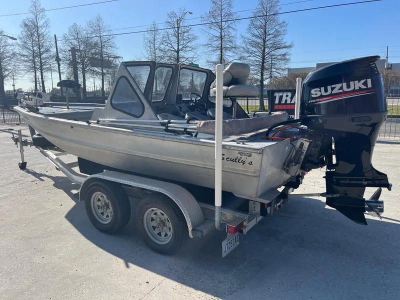 Slide: The Image of 1991 Scully's 18ft Aluminum Walk Thru boat with Suzuki outboard motor on trailer. - 5
