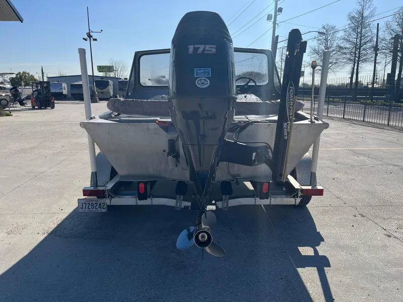 Slide: The Image of 1991 Scully's 18ft Aluminum Walk Thru boat with 175 HP motor on trailer. - 6