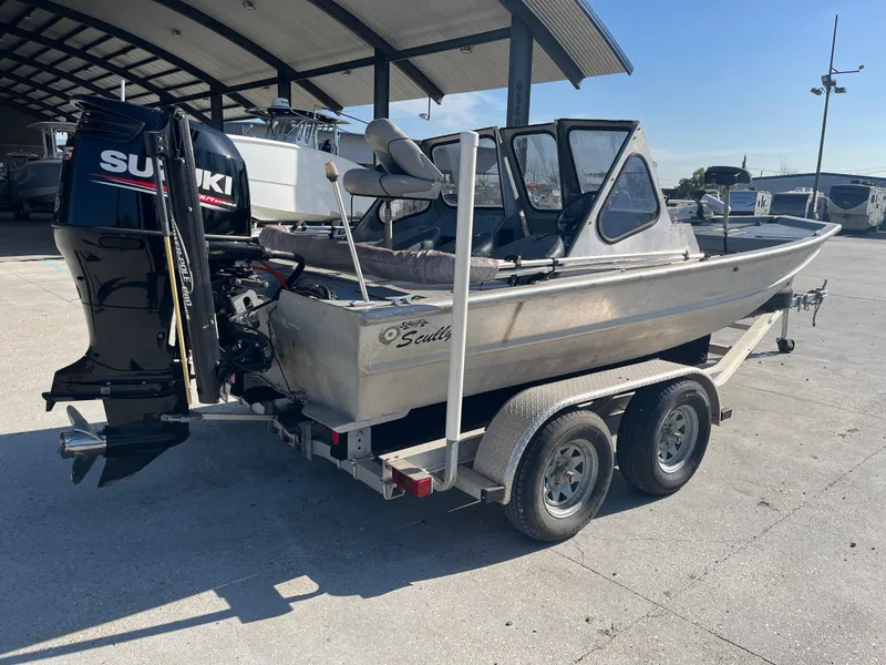 Slide: The Image of 1991 Scully's 18ft Aluminum Walk Thru boat on trailer with Suzuki outboard motor. - 7