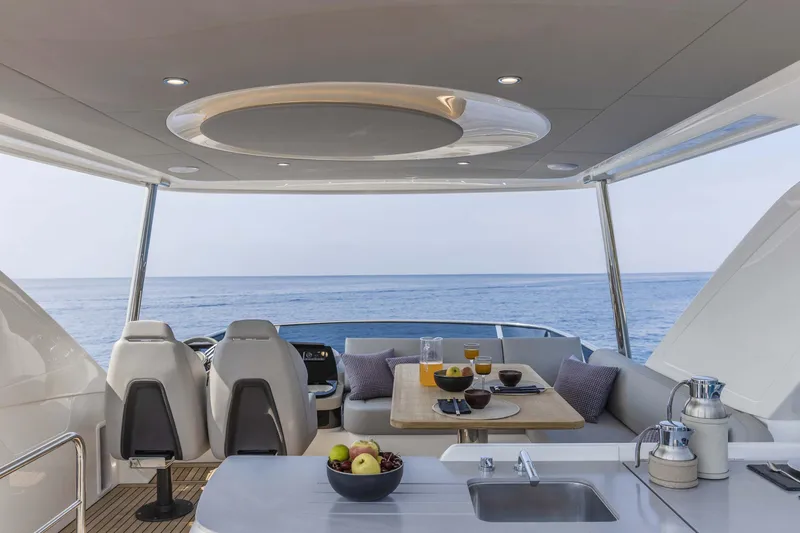 Slide: The Image of Luxurious interior of 2026 Absolute 52 FLY yacht with ocean view. - 3