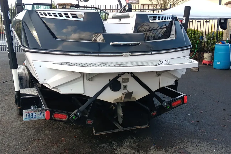 Slide: The Image of 2014 Correct Craft Super Air Nautique 230 boat on trailer, rear view. - 11